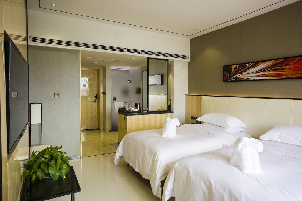 Lori Star Hotel Qionghai Habitación foto