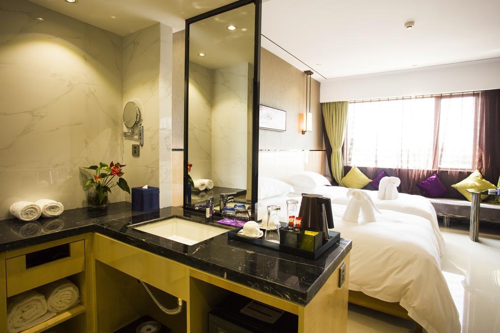 Lori Star Hotel Qionghai Habitación foto